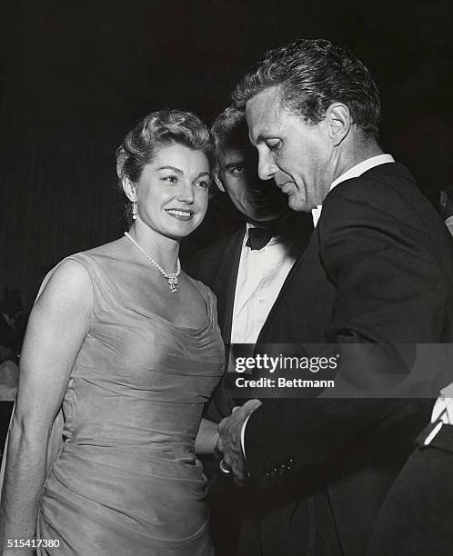 Don't be misled, Esther Williams is NOT dating Robert Stack, as you can see for yourself when you catch a glimpse of Esther's steady date Jeff...
