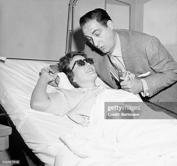 Television actress Nanette Fa bray chats with her "TV husband" Sid Caesar, during his visit in her room at Mt. Sinai Hospital today. Nanette suffered...