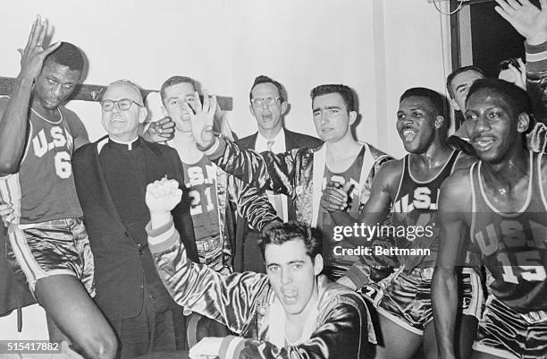 The University of San Francisco made basketball history by winning their 40th straight victory by the score of 33-24. Shown in the dressing room...