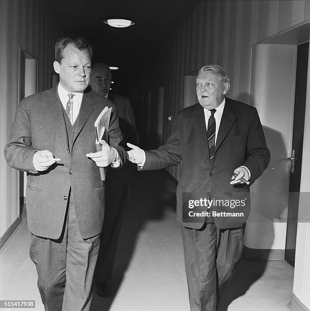 Discuss Aid for Berlin. Bonn, West Germany: Still apparently engrossed in their discussions, West Berlin mayor Willy Brandt and West German Economics...