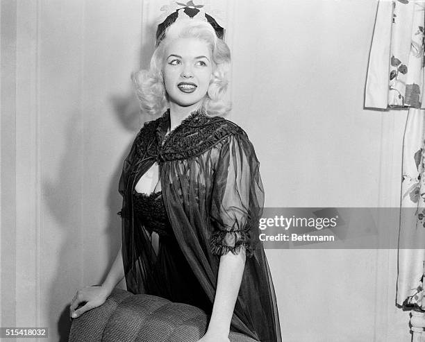 Jayne Mansfield, rising young star of Will Success Spoil Rock Hunter? is shown after being crowned as "Miss Negligee of 1956" today. Jayne, America's...