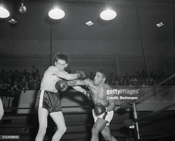 Rory Calhoun bounces a long right off Jerry Luedee's chin in the tenth round of their middleweight go at St. Nick's tonight. Calhoun of White Plains,...
