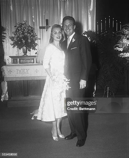 Actor Robert Stack and actress Rosemarie Bowe look as happy as only newlyweds have a right to look as they pose after their marriage in the Beverly...