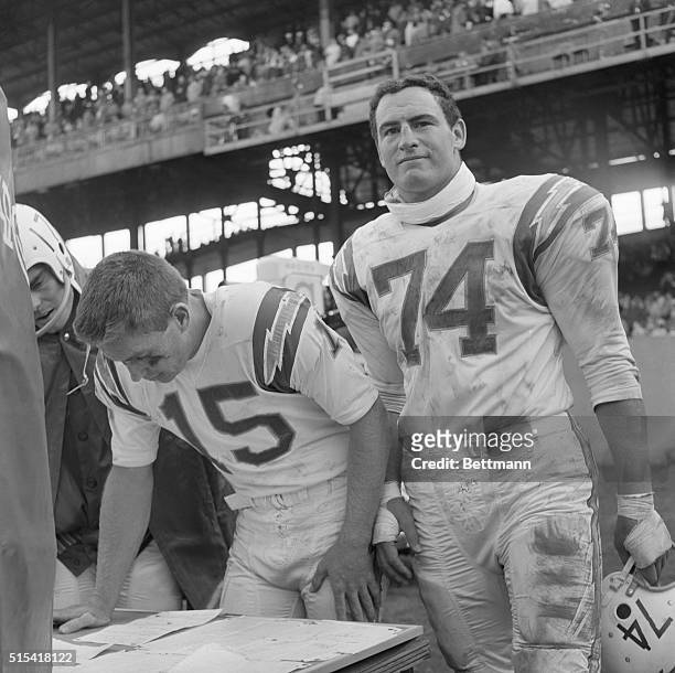 May Exchange Uniforms. New York: San Diego Chargers Jack Kemp, , and Ron Mix, display that "in-the-same-boat" look before game with the New York...