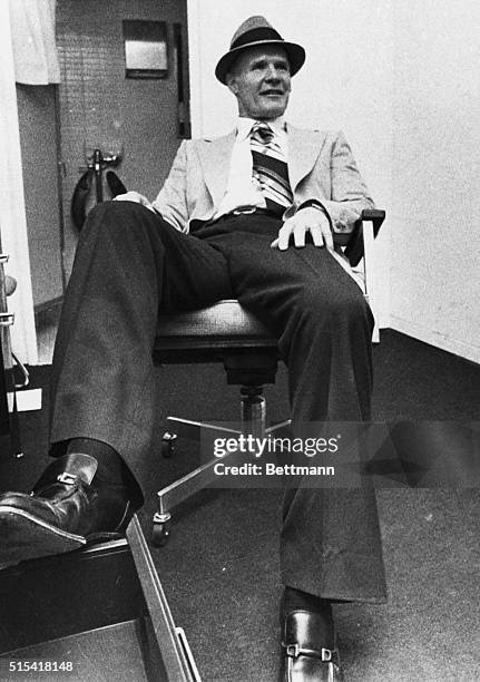 New Orleans: Relaxed and enjoying the moment of peace, Dallas Cowboy coach Tom Landry stretches his legs in his office following his teams 27-10...