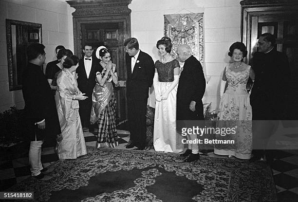 President and Mrs. Kennedy were guests of honor at a dinner at the Indian Embassy here tonight given by Indian Prime Minister Nehru. At a picture...