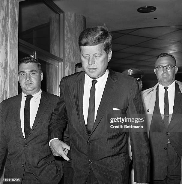 President John F. Kennedy is accompanied by Press Secretary Pierre Salinger as he leaves Baylor University Medical Center after a 20 minute visit...