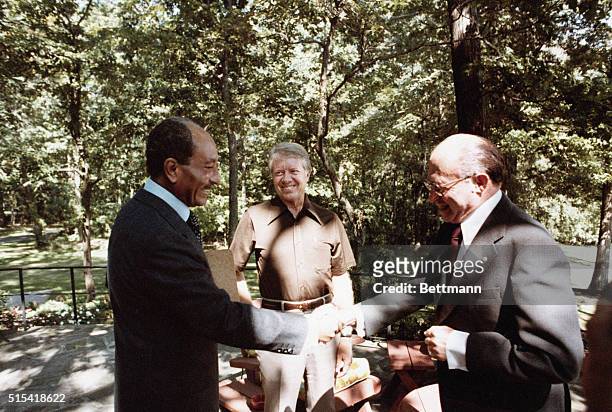 Camp David, MD- President Jimmy Carter, Egyptian President Anwar Sadat and Israeli Prime Minister Menachem Begin are shown at Camp David, MD, the...