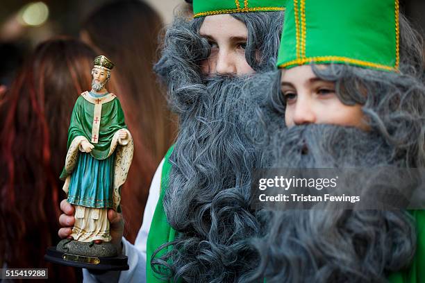 Statue of St Patrick is carried during the St Patrick's Day parade through central London on March 13, 2016 in London, England.