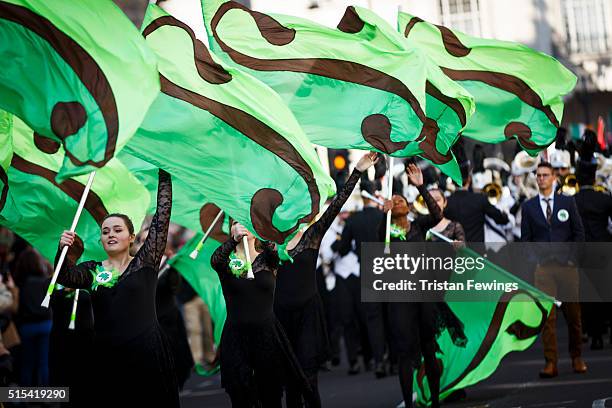 Members of the Coppell High School Marching Band take part in the St Patrick's Day parade through central London on March 13, 2016 in London, England.