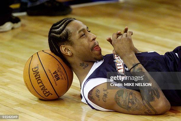 Philadelphia 76ers player Allen Iverson takes a break during the NBA All-Star East team practice session 12 February, 2000 at the Arena in Oakland,...