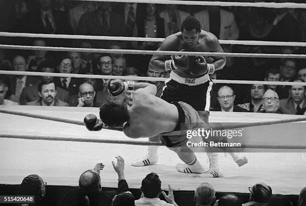 New Orleans: Challenger Terry Daniels falls through the ropes in fourth and final round of his heavyweight title bout with champion Joe Frazier.