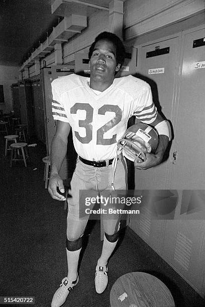 Simpson, newly acquired Running Back from the Buffalo Bills, tries on his San Francisco 49'ers uniform for the first time. Simpson ranks second only...