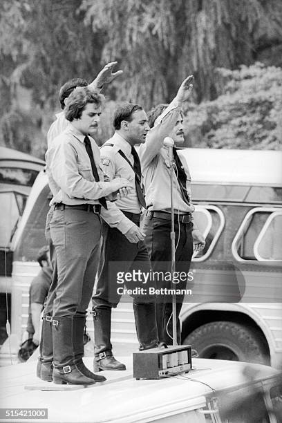 His aides salute as Neo-Nazi leader Frank Collin speaks from top of a van at a Nazi rally in Marquette Park 7/9. Collin was protected by some 1,500...