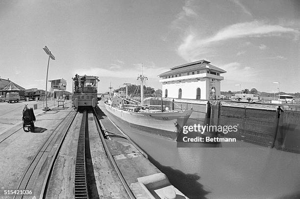 Ship passes through the Miraflores locks of the Panama Canal. President Carter and Gen. Omar Torrijos of Panama will exchange the ratified Panama...