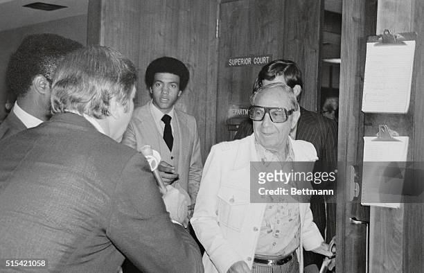 Santa Monica, Calif.: Groucho Marx' younger brother Zeppo talks to reporters as he leaves courtroom at Santa Monica Superior Court. Zeppo said, "it...
