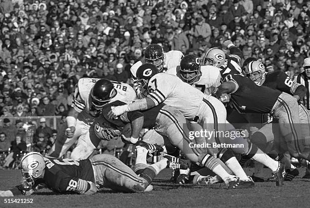 Green Bay Packer back Donny Anderson is stopped by Chicago Bears Dick Butkus and George Seals after gaining four yards in the second quarter of the...