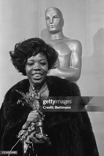 Aletha Finch, widow of late actor Peter Finch, holds the Oscar won by her late husband for Best Performance by an Actor for his role in Network. In...