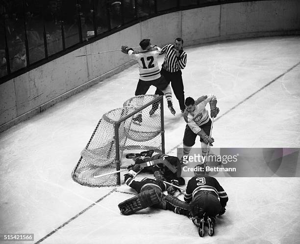 Ranger goalie Lorne Worsley, , received the help of Jack Evans , and Harry Howell, , to prevent a scoring drive by Canadien Henri Richard. In...