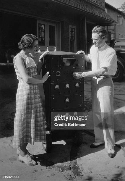 Philo T. Fransworth, 28-year-old inventor, and scientist, explaining to his wife the intricate details of the television apparatus on which he has...