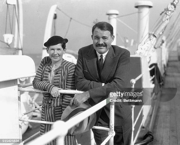 Photo shows Ernest Hemingway, the well-known writing gentleman, with his second wife Pauline. They were among the passengers on the S.S. Paris on its...