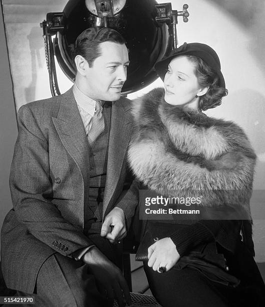 Ivan Lebedeff, Hollywoods champion hand-kisser, is pictured with Wera Engels, German actress, outside the studio. The Russian actor and the newcomer...