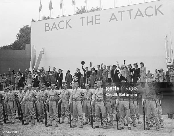 Galaxy of Hollywood stars attended the preview of the Treasury's Back The Attack Show. On the stage are Dick Powell; Fred Astaire; Betty Hutton; Kay...