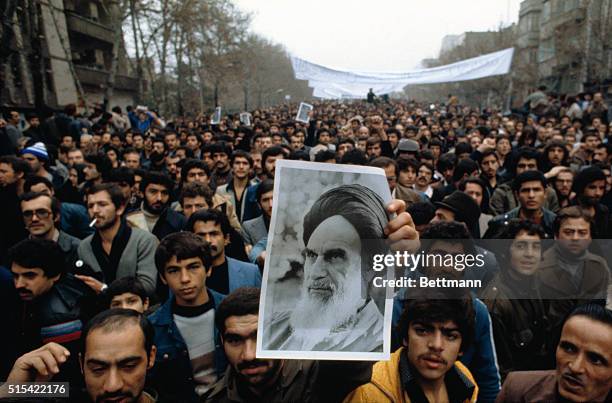 Tehran, Iran: Demonstrators carry photo of Ayatollah Khomeini during anti-shah demonstration.