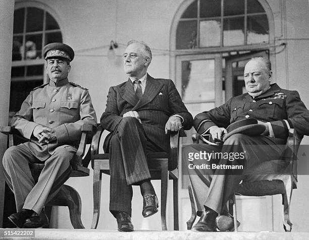 The Big Three. The fate of a doomed Axis was sealed when these three meeting for a three-day conference in Teheran, put their heads together and...
