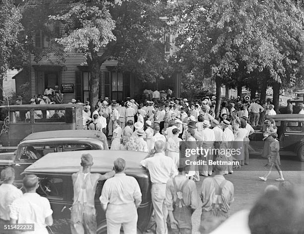 Crowd gather outside a funeral home where John Dillinger's body was taken after he was gunned down by FBI agents on a Chicago street. | Location:...