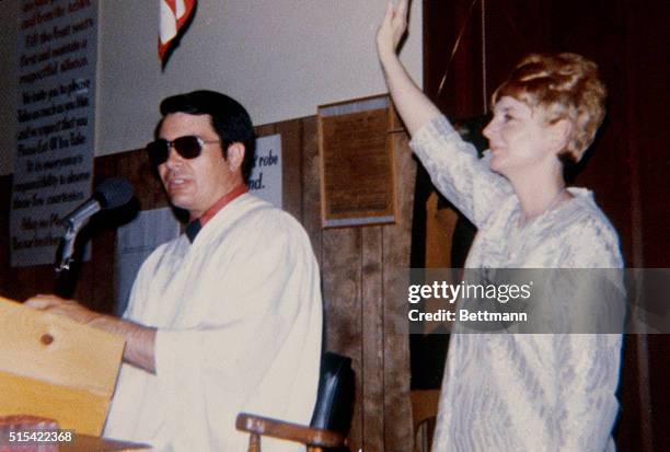 Reverend Jim Jones and his wife, Marceline, taken from a pink photo album left behind in the village of the dead in Jonestown, Guyana, during...