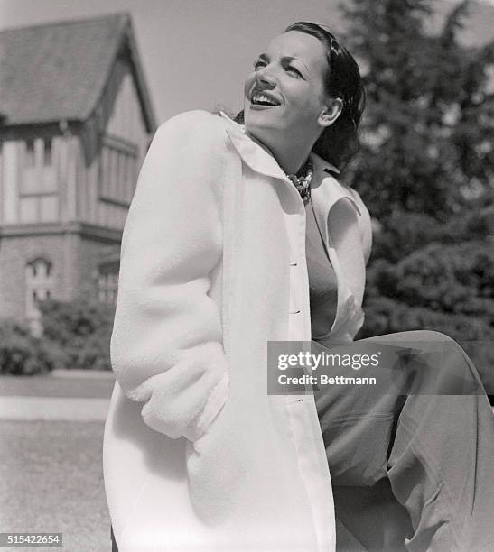 Although she's public enemy number one of the King's English, Carmen Miranda knows her fashion lines well. Her wardrobe reflects the sparkle of her...