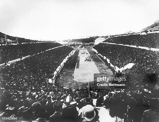 Panaromic view of the 1896 Olympic Games held in a crowd-filled stadium in Athens, Greece.