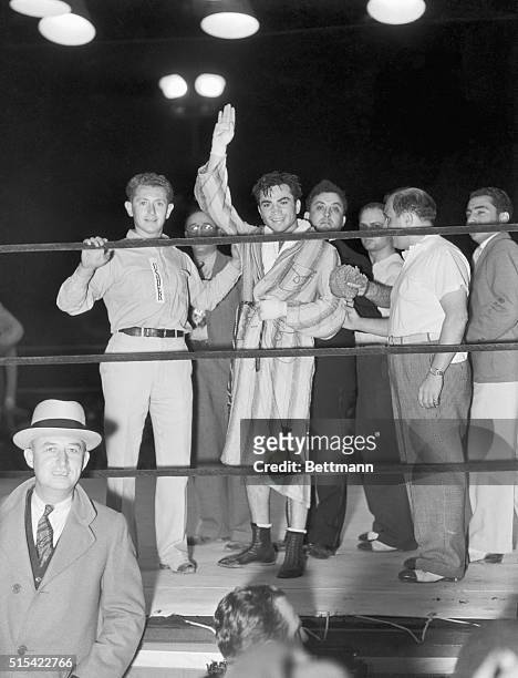 Barney Ross of Chicago, junior welterweight and lightweight title holder, being declared winner in his bout with Frankie Klick.
