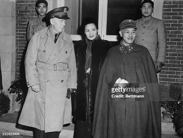 Special envoy to China General George C. Marshall is pictured with Generalissimo and Madame Chiang Kai-Shek outside their home in Nanking.