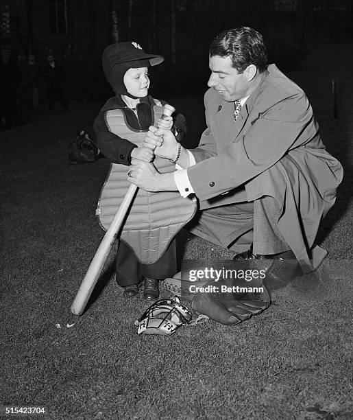 Donald Anderson, the 1946 March of Dimes "Poster Boy," donned diamond gear and took his first baseball lesson from New York Yankees' star Joe...