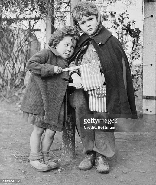 Candy from the far-away American Junior Red Cross brings real joy to these fun-starved children of La Courneuve, France, as they wait at St. Yves...