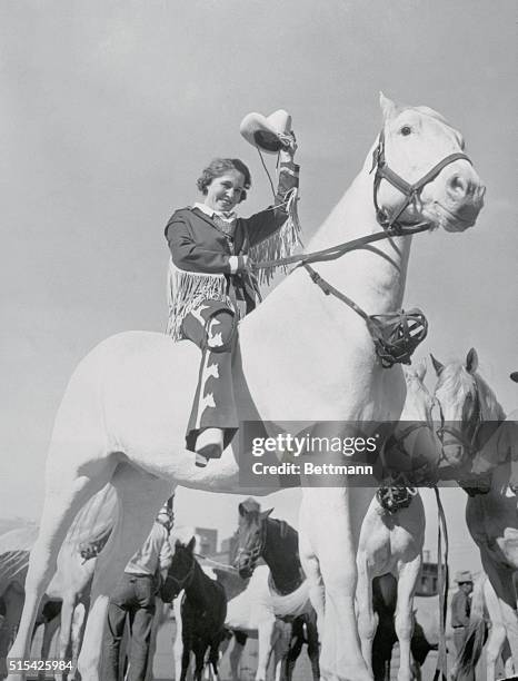 Girls and boys of the golden West--bow-legged, tanned cowboys and hard-riding cowgirls in their double-barreled skirts--are coming to town from the...