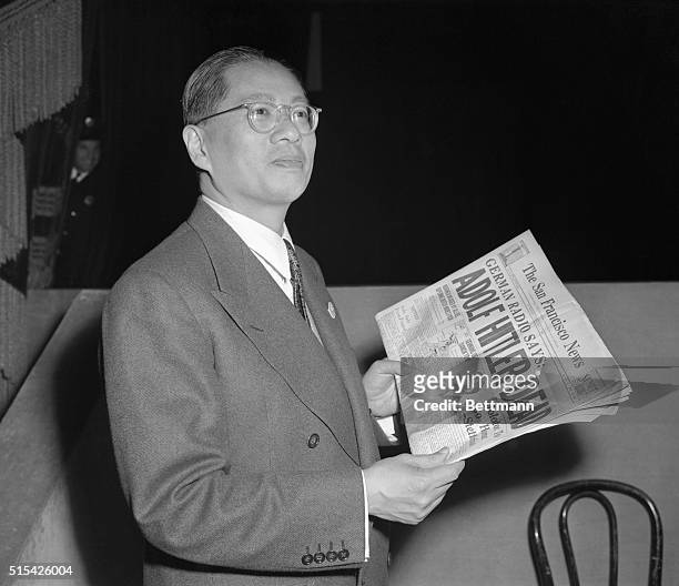 Foreign minister T. V. Soong of China, is shown attending the plenary session of UNC, as he happily reads newspaper report of Hitler's death.