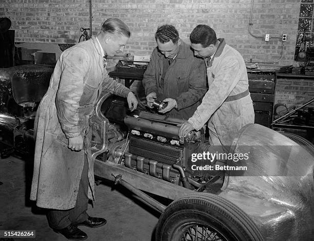 Tony Bettenhausen , midget and dirt track race driver, of Tinley Park, Illinois, looks over the car he is to drive in the 500-mile race next Memorial...