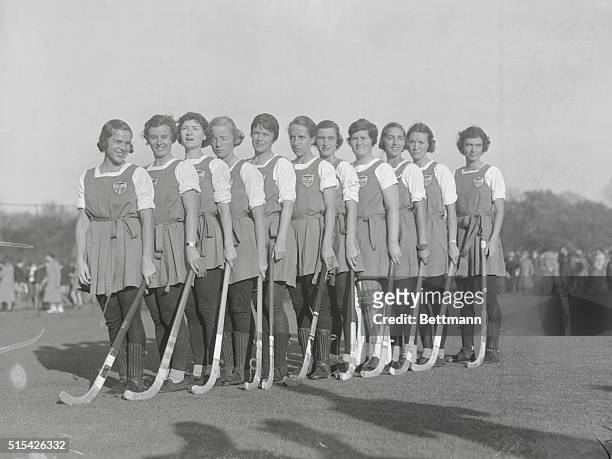 Group portrait of an All-American women's field hockey team including, left to right, Mrs. Catherine K. Clegg, Miss Betty Richey, Miss Betty Taussig,...