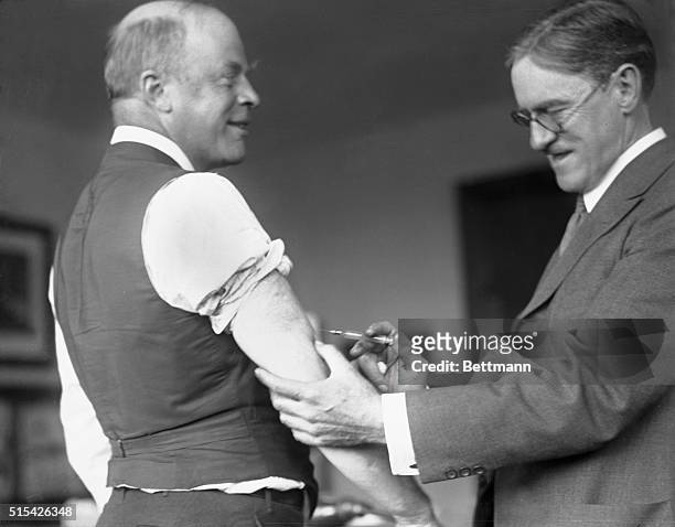 Everyone is getting his flu shots and the mayor of Boston is no exception. Mayor Peters of Boston is shown being inoculated by the doctor for the...