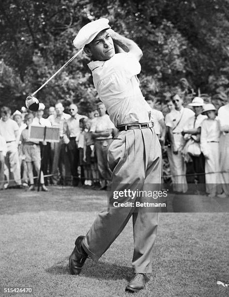 American golfer, Ben Hogan, follows through on a swing before a field of spectators at the U.S. Open in Ladue, Missouri, June 16th 1947.