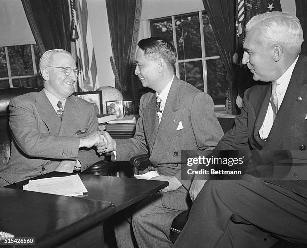 President-elect Manuel Roxas of the Philippines is shown being greeted by President Harry Truman during his visit to the White House on May 10th....