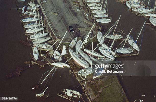 Seabrook, Texas: Hundreds of thousands of dollars of luxury yachts lie jumbled up at the Houston Yacht Club here. The damage was caused by the August...