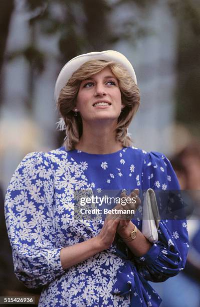 During a trip to Canada, Diana, Princess of Wales, claps her hands during a visit to the Edmonton Convention Center for a cultural exhibition.