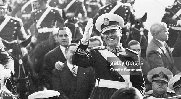 Buenos Aires, Argentina: New Argentine President Greets His People. Smiling broadly, newly-elected President of Argentina Juan Peron stands in the...