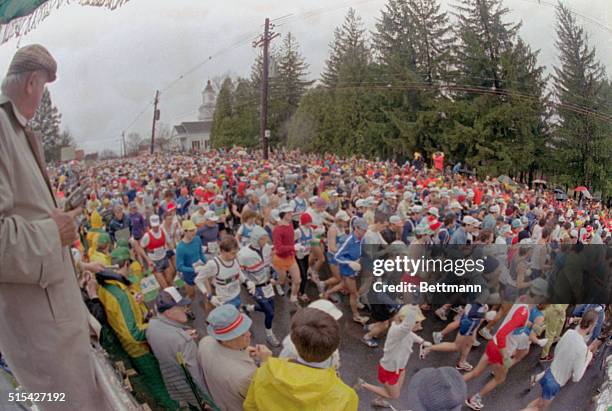 Boston Marathon. Hopkinton, Massachusetts: Tom Brown , the official starter of the Boston Marathon, watches the mass of runners run by shortly after...