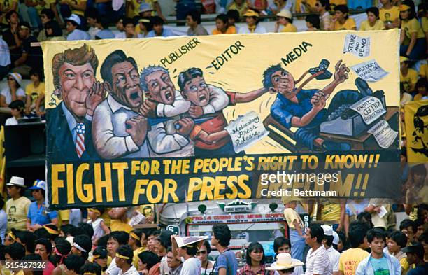Manila, The Philippines: Some of 60,000 Filipinos march through Roxas Boulevard for an anti-government rally in Manila's Luneta Park marking the 51st...