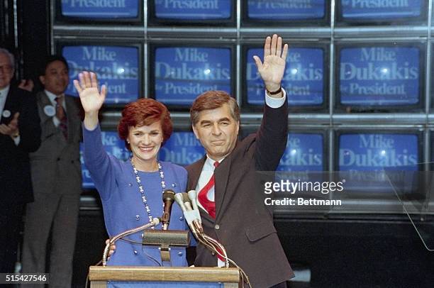 Michael Dukakis and his wife, Kitty, acknowledge cheers of supporters 3/8 as the "Super Tuesday" results give the Massachusetts governor a slight...